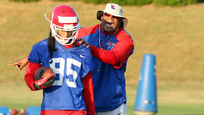 Former Louisiana Tech running backs coach Jabbar Juluke, right, set a standard with the Bulldogs that new assistant Mickey Joseph wants to uphold.