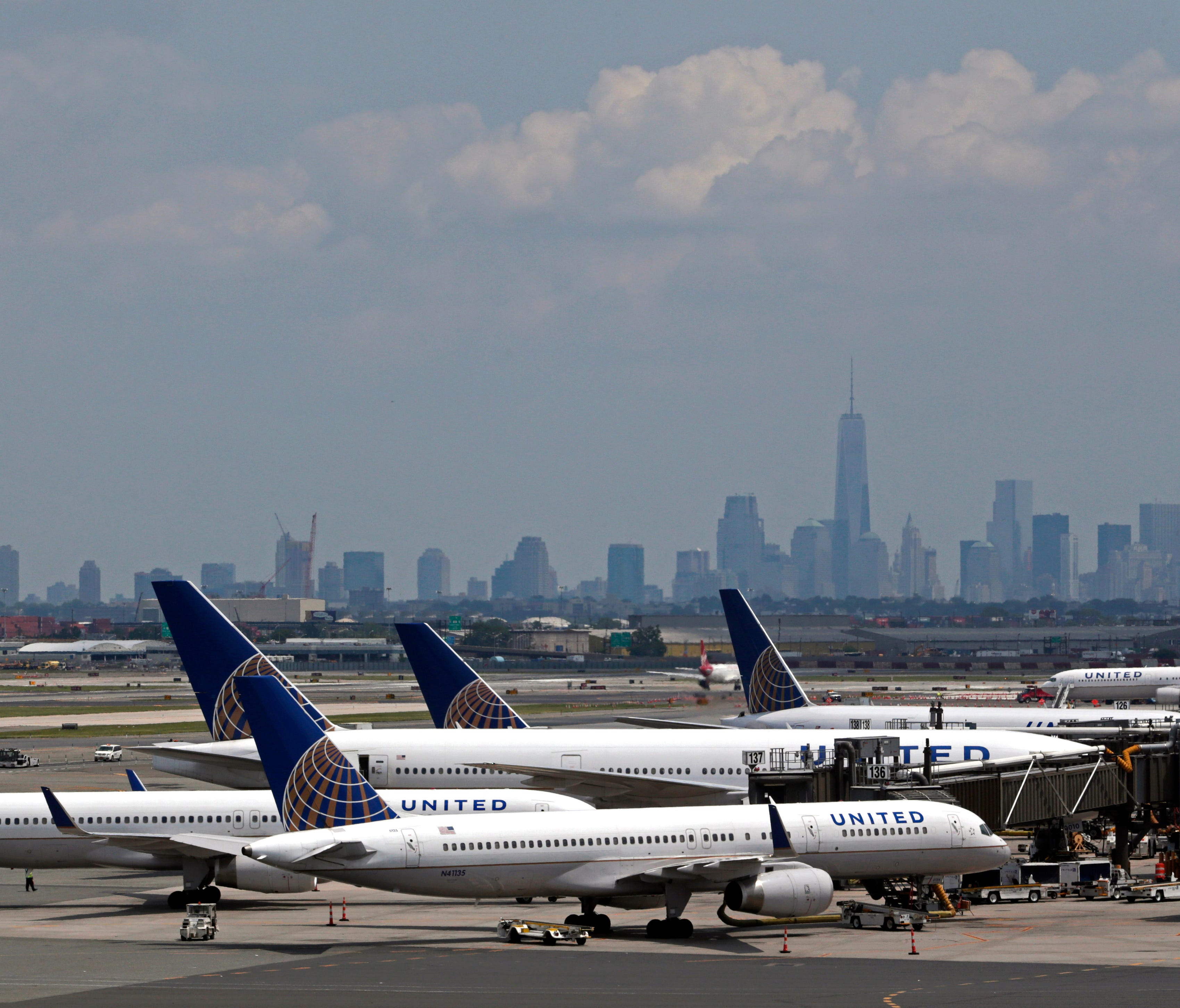 United Airlines jets wait at gates at Newark Liberty International Airport.