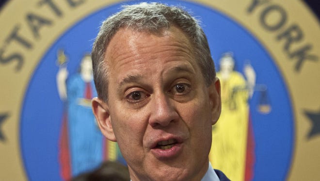 State Attorney General Eric Schneiderman speaks during a 2014 news conference in New York.