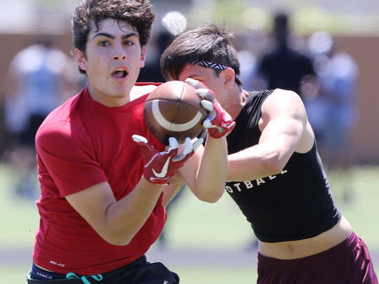 Joe Lovera of Elmwood Park makes a catch against Becton in a 7-on-7 football tournament.