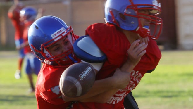 FILE - Indio High School varsity football team practices in August in preparation for their upcoming 2016-2017 season.