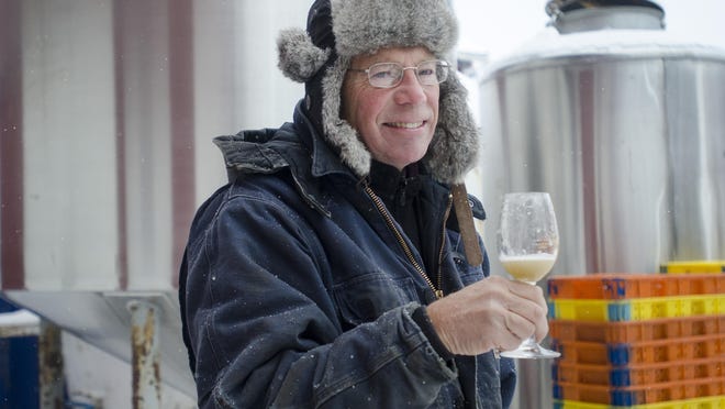 Art Hunt, owner of Hunt Country Vineyard in Branchport, N.Y., holds a glass of juice from freshly crushed vidal blanc grapes. Ice wine has a long history in Germany and is big in Canada, but it remains a small niche in the U.S. wine industry, confined mostly to upstate New York, Ohio and Michigan.
