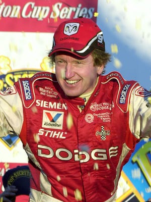 Bill Elliott celebrates in victory lane after winning at North Carolina Speedway on Nov. 9, 2003. He retired from full-time competition after that season.