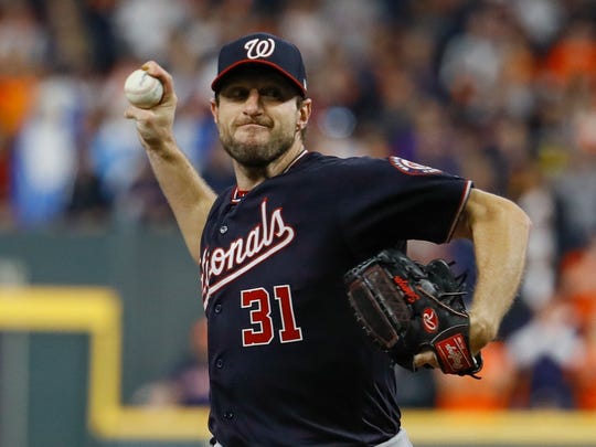 Washington Nationals starting pitcher Max Scherzer throws during the first inning of Game 7 of the baseball World Series against the Houston Astros Wednesday, Oct. 30, 2019, in Houston. (AP Photo/Matt Slocum)