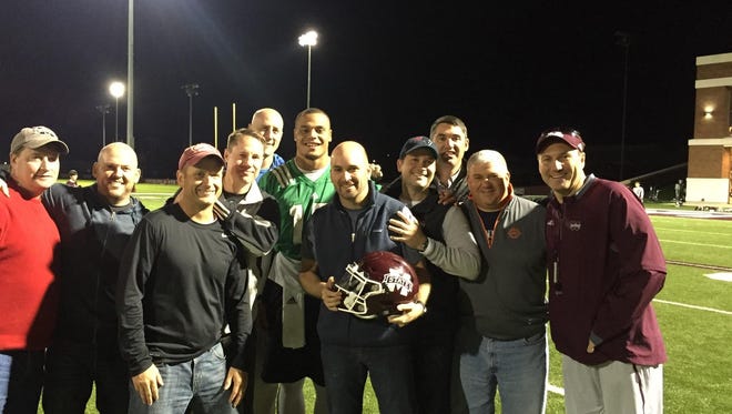 Mississippi State coach Dan Mullen poses for a picture with his high school friends and former MSU quarterback Dak Prescott.