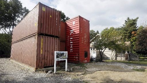 A home built of commercial shipping containers is under construction in Royal Oak.