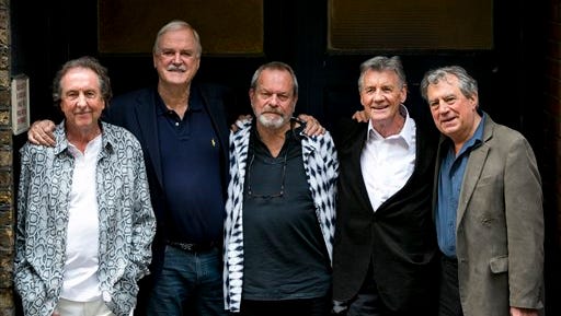 From left, Eric Idle, John Cleese, Terry Gilliam, Michael Palin and Terry Jones of the comedy group Monty Python pose for photographers during a photo call in London, Monday, June 30, 2014, to promote their reunion for a series of concerts.