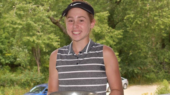 Dover's Carys Fennessy is all smiles after capturing her second straight NHGWA Junior Championship last month at Amherst CC.