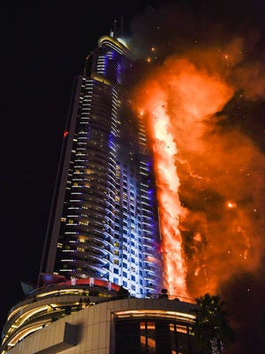 Flames consume the The Address Downtown Hotel in Dubai in December 2015.