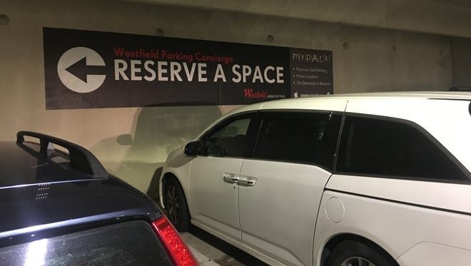 A sign directing shoppers in a Garden State Plaza parking lot to the reserved parking area