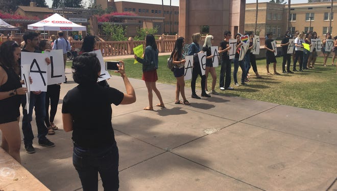 A class holds a protest against Trump's administration on Arizona State University's Tempe campus.