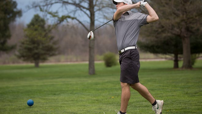 Yorktown's Brevin Smith takes his second swing on April 10 during a match against Cowan. 