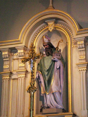St. Patrick in his proper spot above the main altar at St. Patrick's Roman Catholic Church, built in 1877 to serve the surrounding Irish-immigrant community in Adell, Wisconsin.