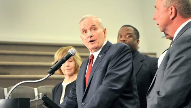 Gov. Mark Dayton spoke during a news conference Monday, Sept. 19, in City Hall after meeting with St. Cloud leaders including Police Chief Blair Anderson and Mayor Dave Kleis, at right.