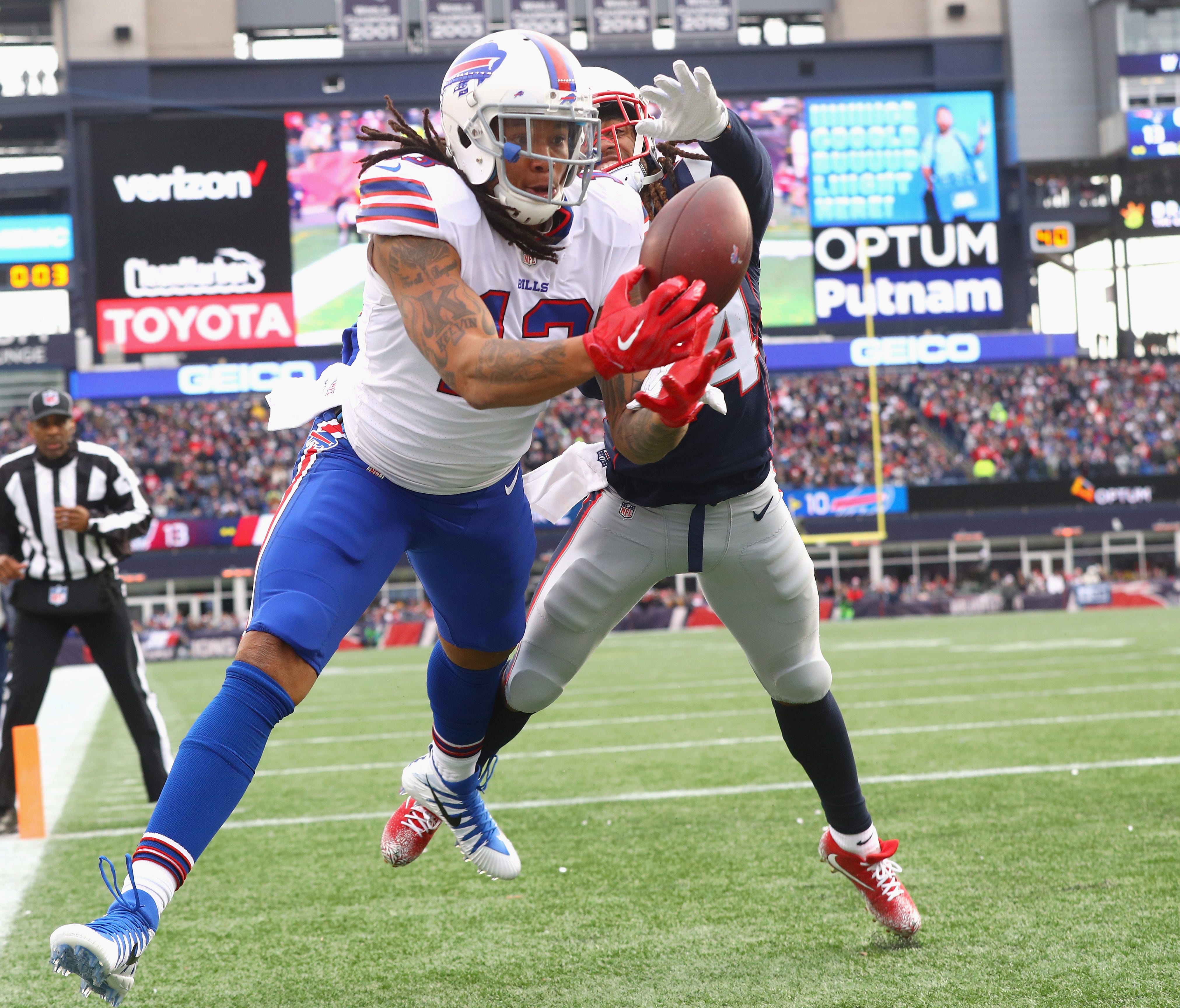 Kelvin Benjamin of the Buffalo Bills tries to catch a pass as he is defended by Stephon Gilmore #24 of the New England Patriots during the quarter of a game against the Buffalo Bills at Gillette Stadium on December 24, 2017 in Foxboro, Massachusetts.