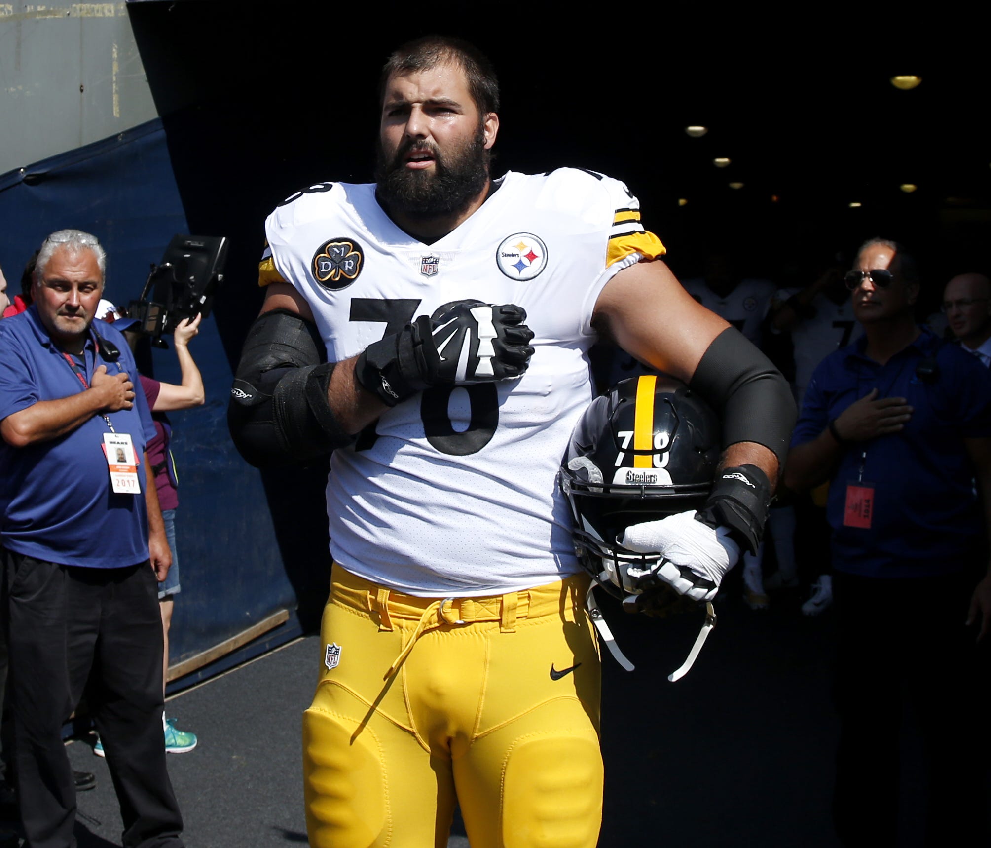 Alejandro Villanueva of the Pittsburgh Steelers stands by himself in the tunnel for the national anthem prior to the game against the Chicago Bears at Soldier Field on September 24, 2017 in Chicago, Illinois.