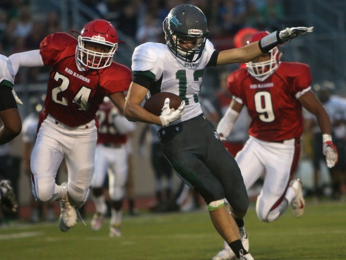 Wauwatosa West's Ean Haller attempts to evade Wauwatosa