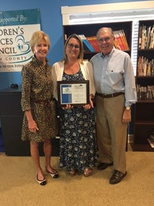 Susan A. Colby, with the Boys & Girls Clubs of Martin County Board of Directors; Tina McSoley of All About Achieving; and William J. Whitman Jr., club board president