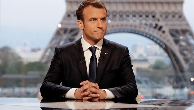 French President Emmanuel Macron on the set before an interview with RMC-BFM and Mediapart French journalists on April 15, 2018.