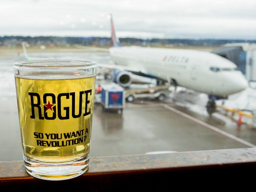 A taster from Rogue Brewery rests on a table at the