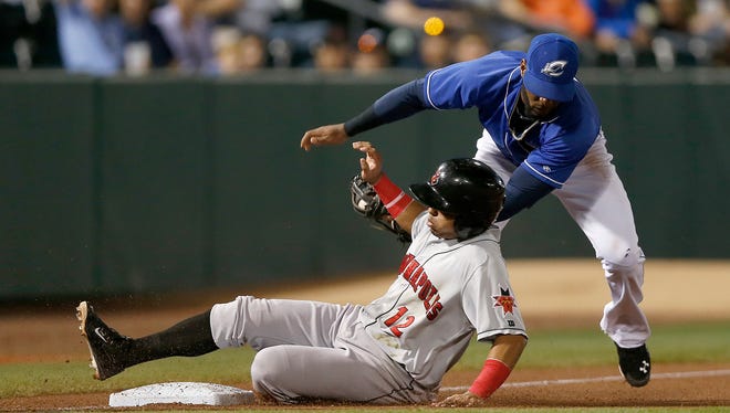 Columbus Clippers third baseman Yandy Diaz (7) tags out Indianapolis Indians shortstop Gustavo Nunez (12) after a throw from Columbus Clippers center fielder Tyler Holt (15) during the second game of the Governors' Cup Championship between the Clippers and the Indianapolis Indians at Huntington Park on Wednesday, September 16, 2015.