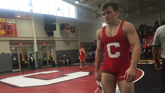 Cornell University wrestler Brian Realbuto maintains intense focused as he walks off the mat following a major decision over Brown's Andrew LaBrie in the Friedman Wrestling Center in Ithaca, N.Y., on Saturday, Jan. 16, 2016.