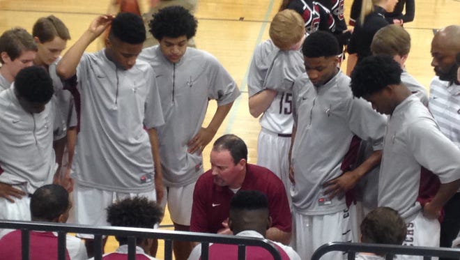 Crockett County coach Jerrod Shelton talks with his players during a timeout in Tuesday's 49-36 district quarterfinal win over South Gibson.
