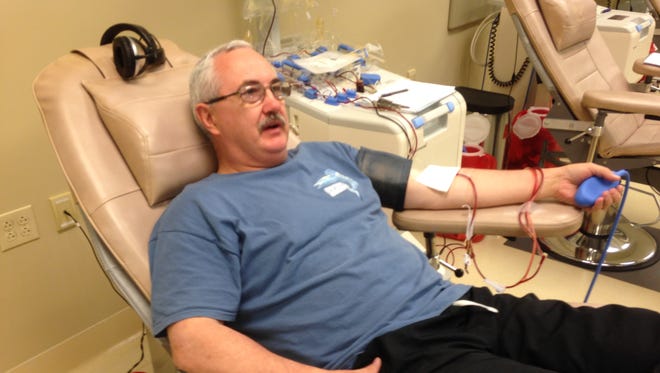 Robert Allen supports the Tennessee Wildlife Resources Agency in the Battle of the Badges blood donation contest Monday.
