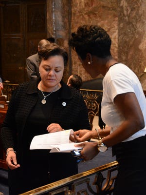 Sen. Karen Carter Peterson, D-New Orleans, talks with a reporter during the final frantic hour of the legislature's special session Wednesdy.