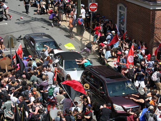 A car plows into pedestrians and vehicles on the mall