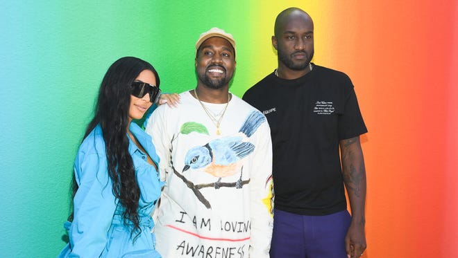 Breakup designer Virgil Abloh, right, poses with Kim Kardashian and Kanye West at the Louis Vuitton Menswear Spring / Summer 2019 show as part of Paris Fashion Week.