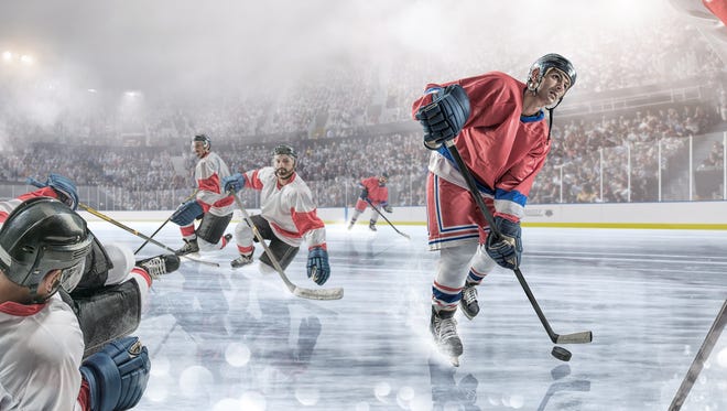 An ice hockey player dribbling puck past rival players during an ice hockey game. The match takes place in a generic floodlit indoor ice hockey arena full of spectators with mist and haze. All players are wearing generic and unbranded ice hockey kit. With intentional water spray and bokeh effects. 