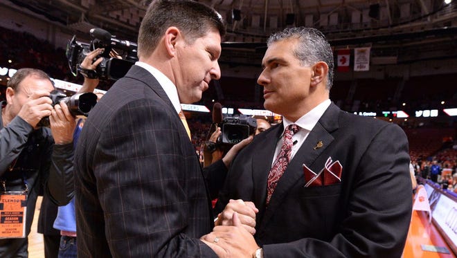 Clemson coach Brad Brownell (left) and USC coach Frank Martin