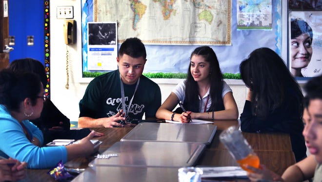 Students in the United Northwest club at Northwest High School in Indianapolis discuss a documentary video on diversity at an after-school meeting on April 7, 2015.