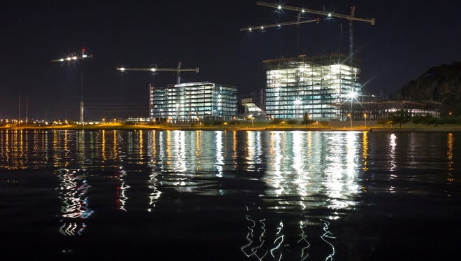 Construction continues at Tempe Town Lake on October 2, 2014. The city has offered an estimated $36 million tax break for developer TrendEx Holdings LLC to buy and build on 11 acres of land in the area.
