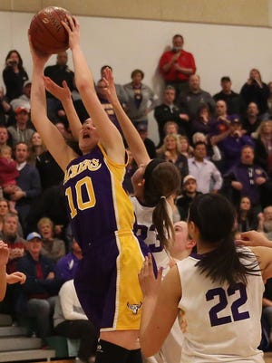 Hannah Kulas comes down with a rebound of Eisenhower's final shot to end the game as Cudahy won, 47-45.