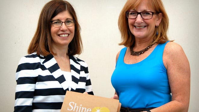 Debbie Nelson, founder of DNA Creative Communications, left, with Susan Meier, principal at Meier & Associates and the featured presenter at a recent Shine the Light Nonprofit forum.