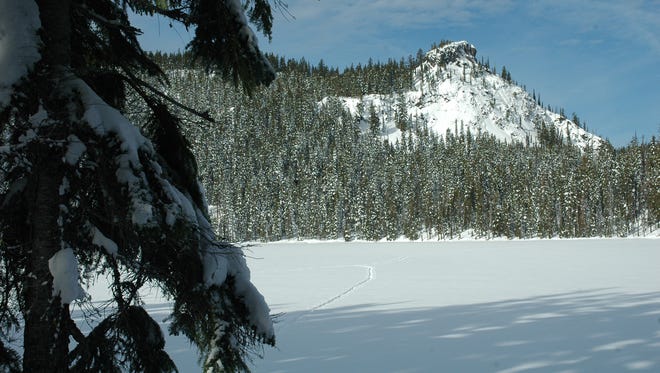 Pulpit Rock is seen from Lower Rosary Lake.
