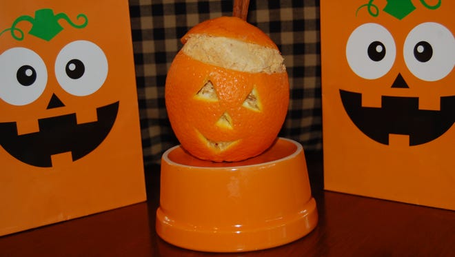 Pumpkin ice cream in orange Jack-o'-Lanterns.