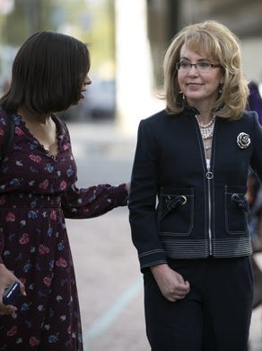 Former U.S. Rep. Gabrielle Giffords (center) her husband, Mark Kelly (right) and Crystal Kasnoff, (background right) the Executive Director, TucsonÕs Memorial Foundation, during the memorial dedication at El Presidio Park in Tucson on Monday, Jan. 8, 2018. The dedication was held on the 7 year anniversary of the Tucson mass shooting that left 6 people dead and 13 others injured including Giffords. The memorial is expected to be completed within the next two years.