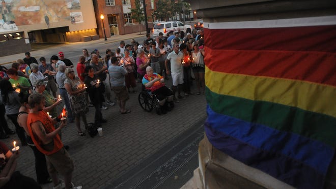 Community members gathered for a candlelight vigil for the victims of the Orlando shooting Thursday evening in downtown Chillicothe.