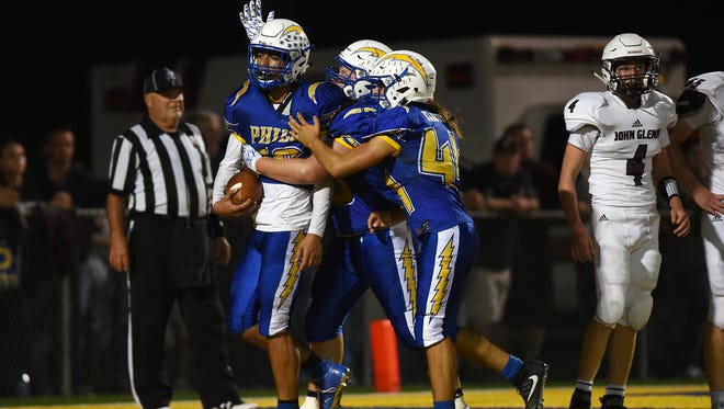Philo celebrates Isaac Gill's touchdown leap against John Glenn during their regular season game in Duncan Falls. Gill accounted for all four of the Electrics' touchdowns, including an interception return.