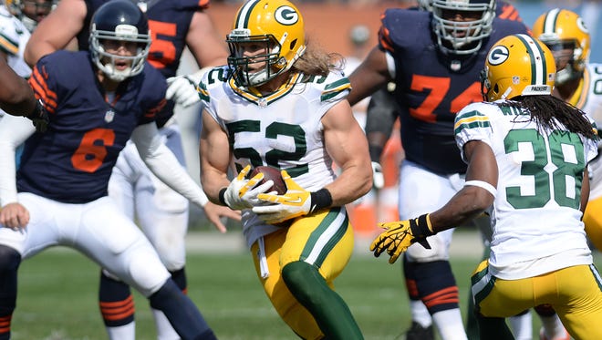 Green Bay Packers linebacker Clay Matthews intercepts a Jay Cutler pass against the Chicago Bears at Soldier Field September 28, 2014.