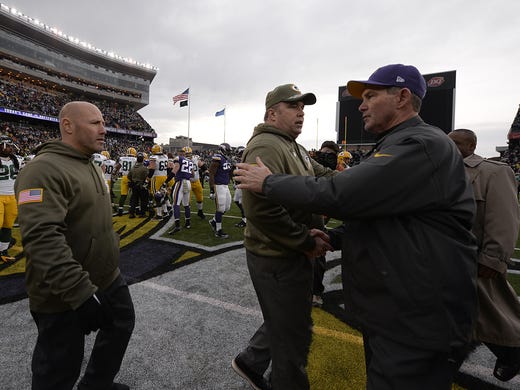 Green Bay Packers head coach Mike McCarthy shakes hands