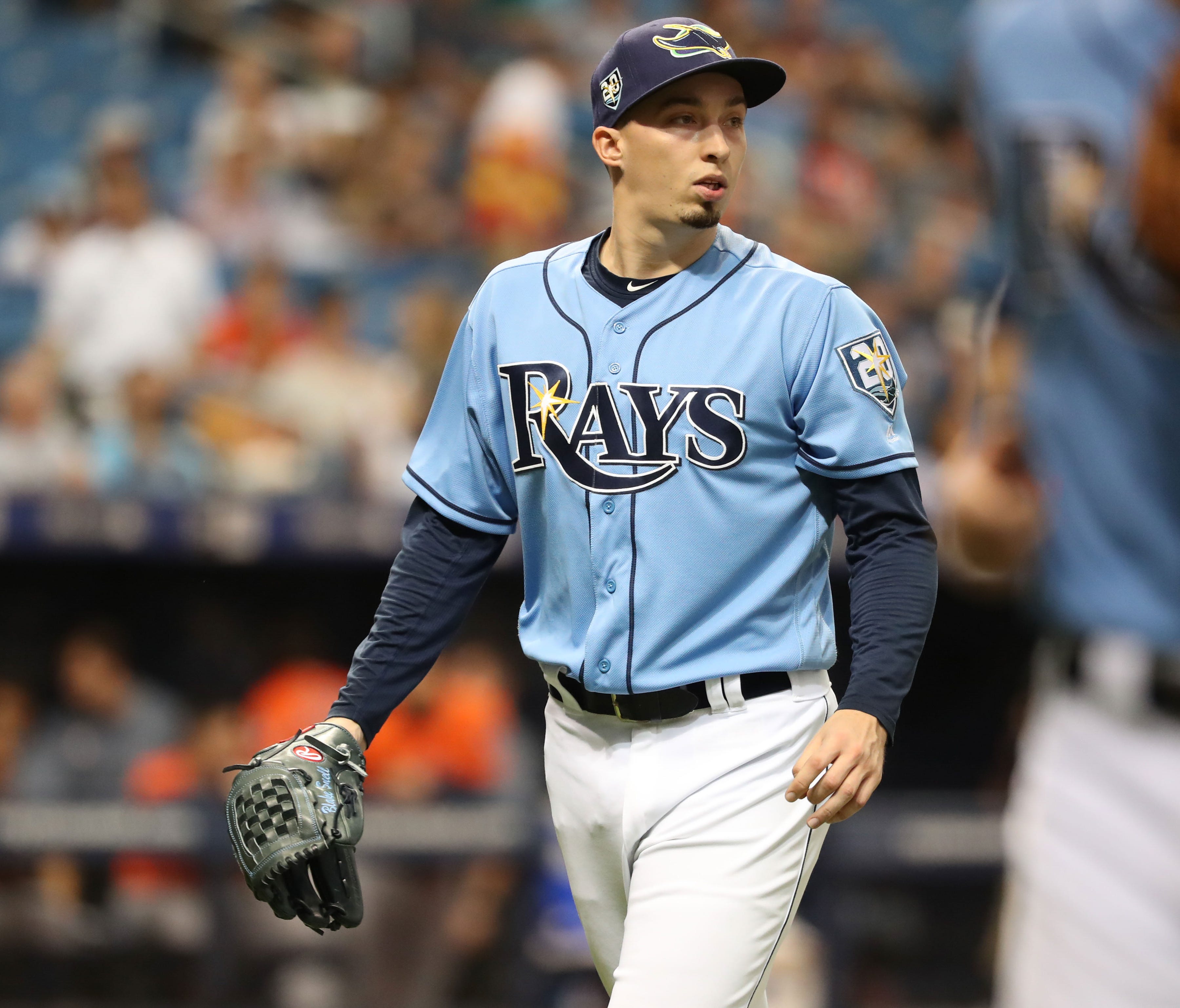 Blake Snell leads the AL in ERA (2.09) while tying for second in wins (12).