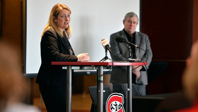 St. Cloud State University Athletic Director Heather Weems talk about the decision to eliminate six of the university's 23 athletic teams as President Earl H. Potter III listens during a press conference Wednesday, March 2, in the Husky Den at Herb Brooks National Hockey Center.