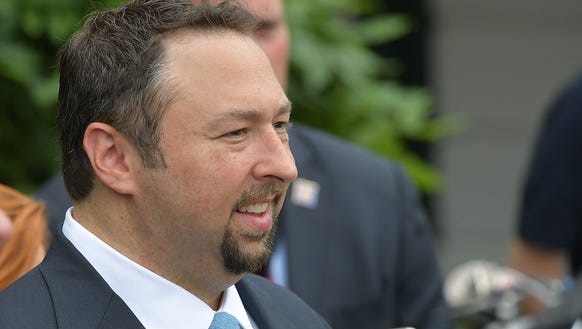Former Trump campaign spokesman Jason Miller waits