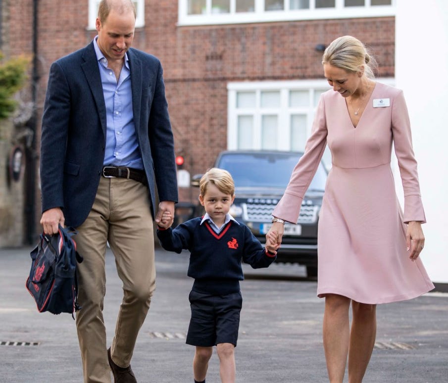 Britain's Prince George, center, arrives for his first day of school at Thomas's school in Battersea in London.
