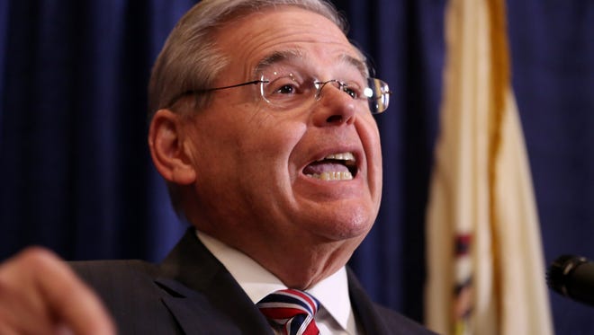U.S. Sen. Bob Menendez speaks during a news conference, Wednesday, April 1, 2015, in Newark, N.J. Menendez, the top Democrat on the U.S. Senate Foreign Relations Committee, was indicted on corruption charges, accused of using his office to improperly benefit an eye doctor and political donor. (AP Photo/Craig Ruttle)