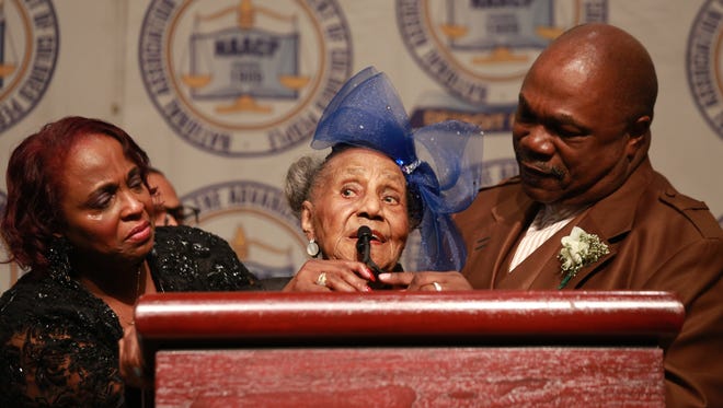 Marilyn Whitt-Horne listens as her grandmother Emma Didlake, 108,of Detroit  receives the James Weldon Johnson Lifetime Achievement Award
at the 58th Annual Fight For Freedom Fund Dinner at Cobo Center in Detroit, Sunday, April 28, 2013.
